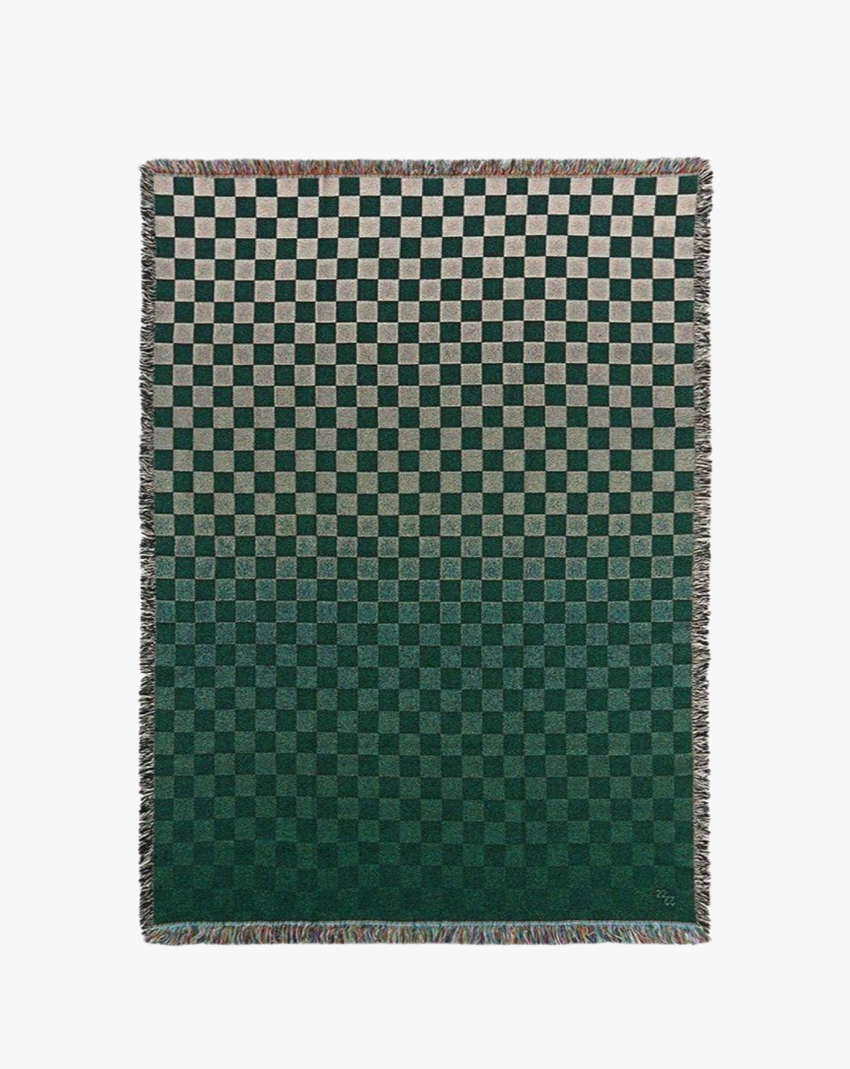A Tori Jacquard Throw by 2222Studio with a green shaded square pattern and darker edges, along with a fringed border, giving it a textured appearance. The design features a gradient effect, darkening towards the bottom. This piece is part of 2222Studio's collection.