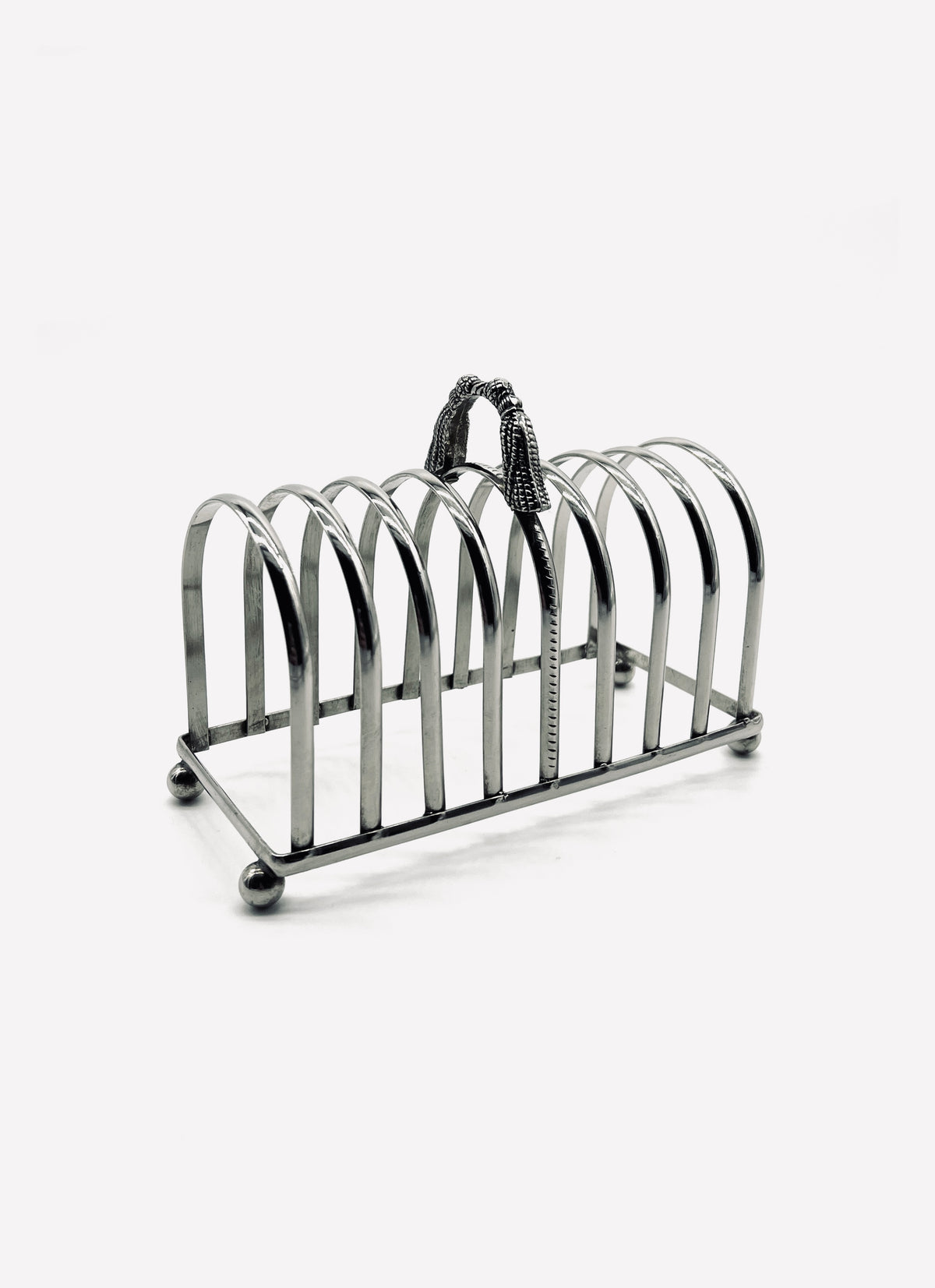 Vintage silver-plated toast rack with decorative rope tassel handle