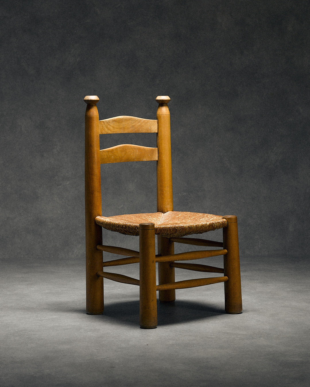 low chair with rush seat, attributed to Charles Dudouyt — close-up