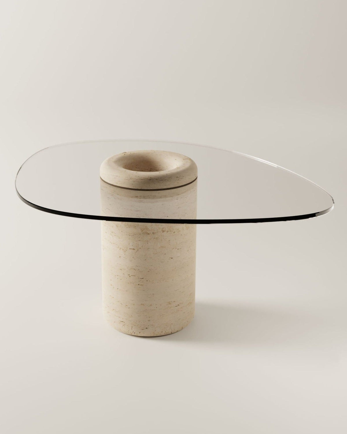 UUFO 01 dining table with travertine pedestal base and glass top