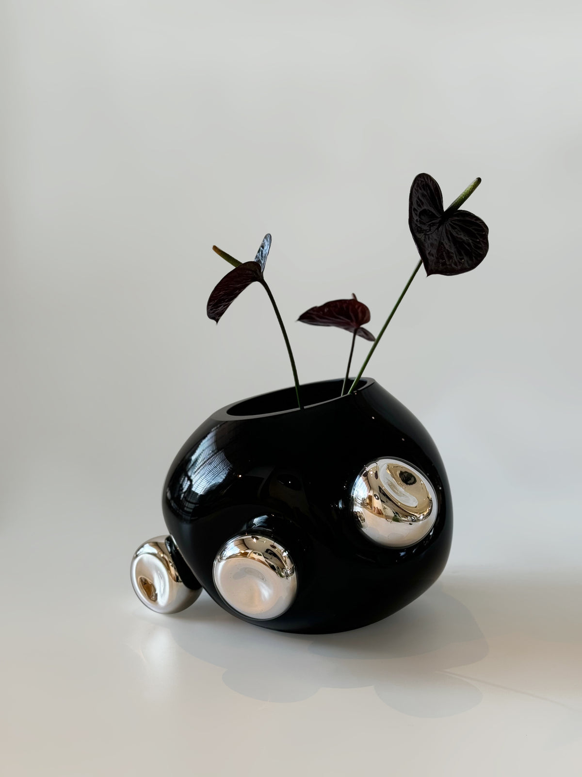 Bud Vase by HOMA | The Oblist — black ceramic with silver accents