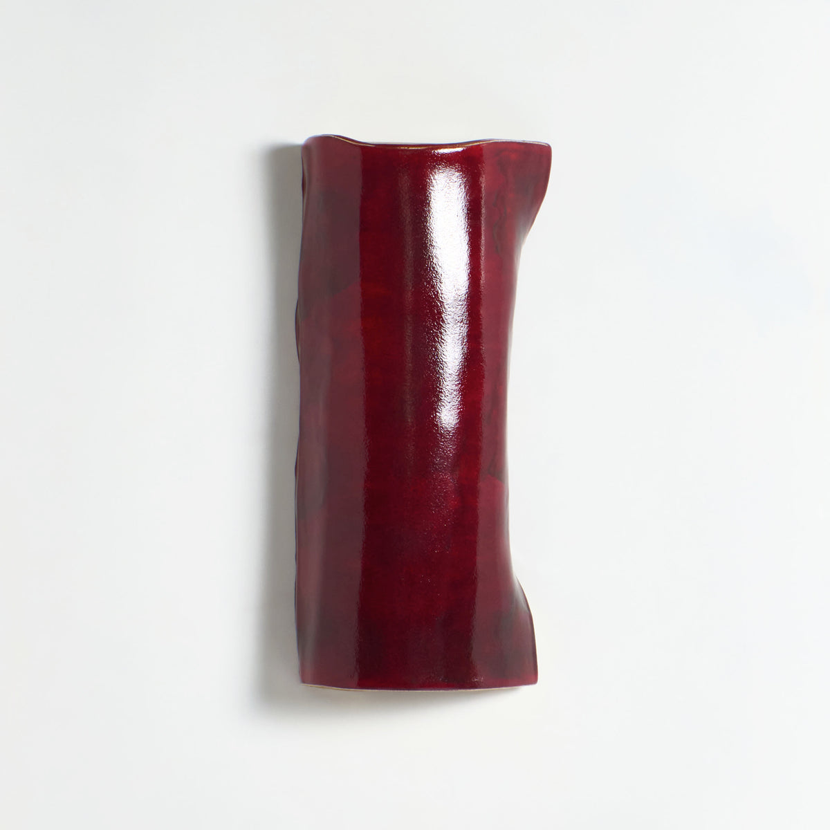 Papel Wall Light (large) — close-up of red textured surface