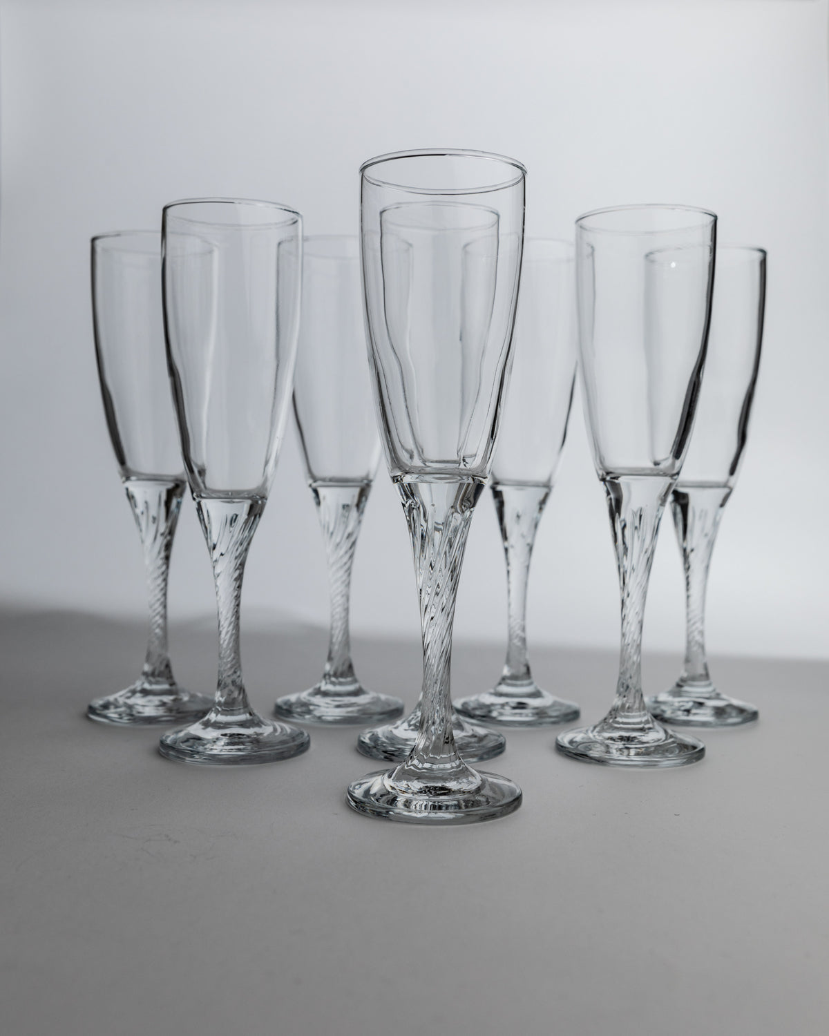 Set of 8 vintage 1980s champagne flutes with twisted crystal stems