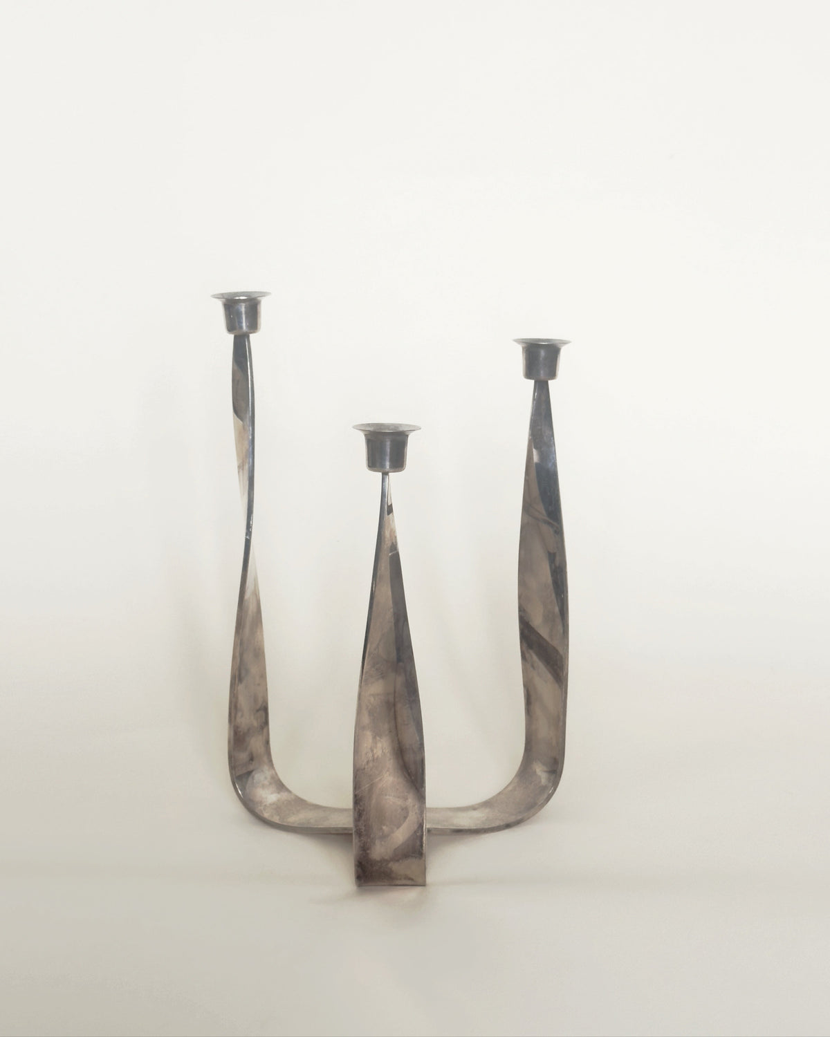 Italian silver-plated ribbon candelabra with three curved holders