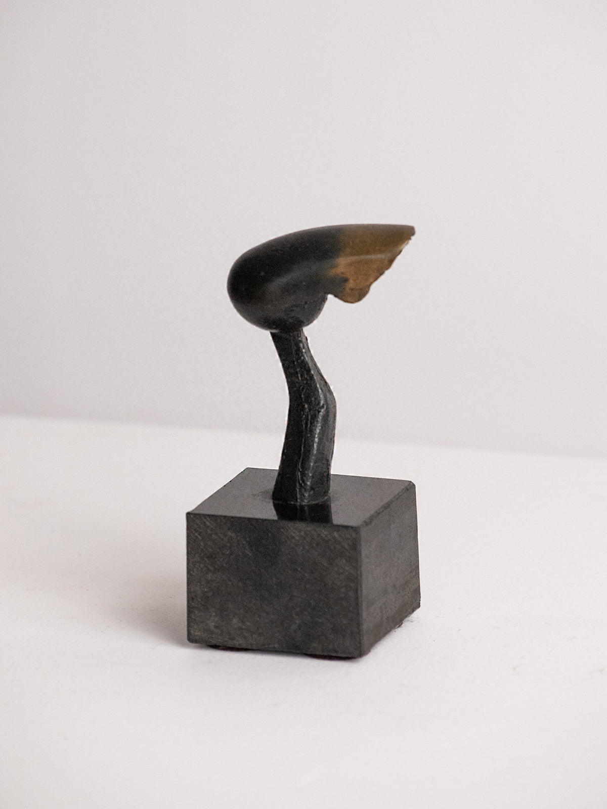 Biomorphic Sculpture in Patinated Metal on a Black Stone Cube, Scandinavian, Late 20th Century by Studio Ecubed