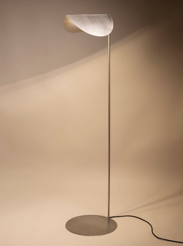 Floor Lamp # 1 standing tall with a sleek black frame and white shade