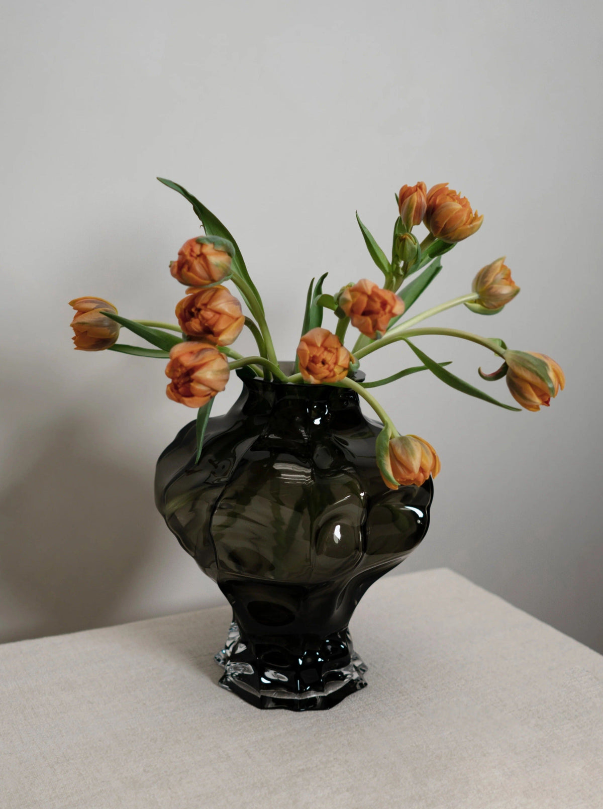Vase made my florists with orange flowers 