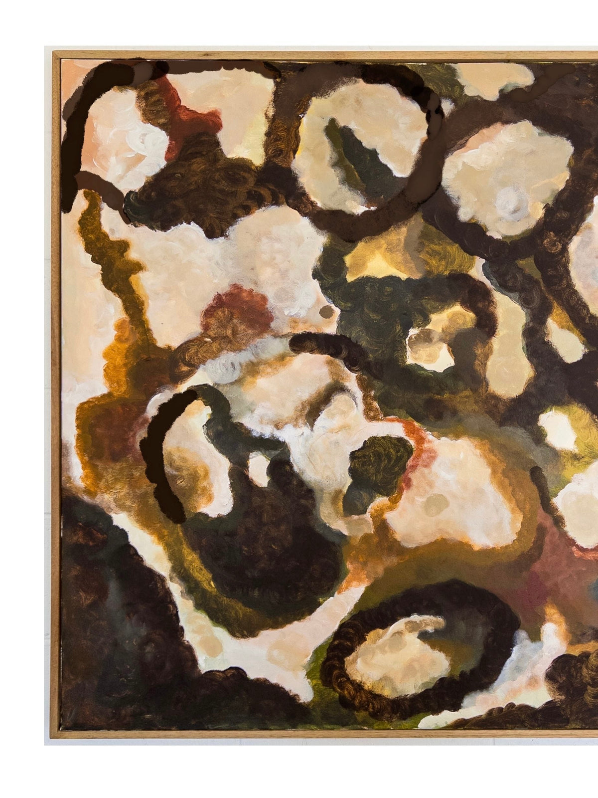 That Which Remains - Painting by Natasha France is an abstract piece rendered on canvas with swirling patterns of dark, earthy brown, green, and cream. This mixed media artwork showcases organic shapes and textures that evoke a sense of depth and movement. It is elegantly framed in a simple, light-colored Tasmanian Oak frame.