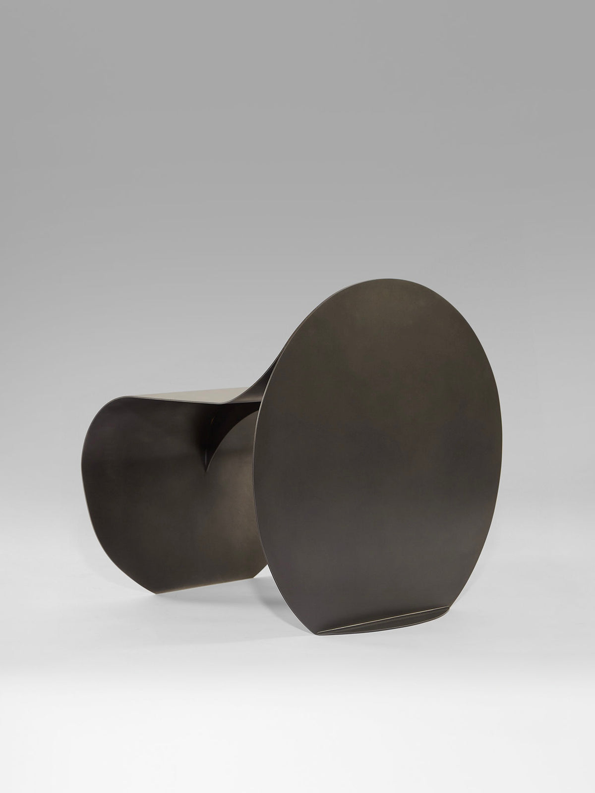 Modern black O stool sculptural chair by Estudio Persona side view