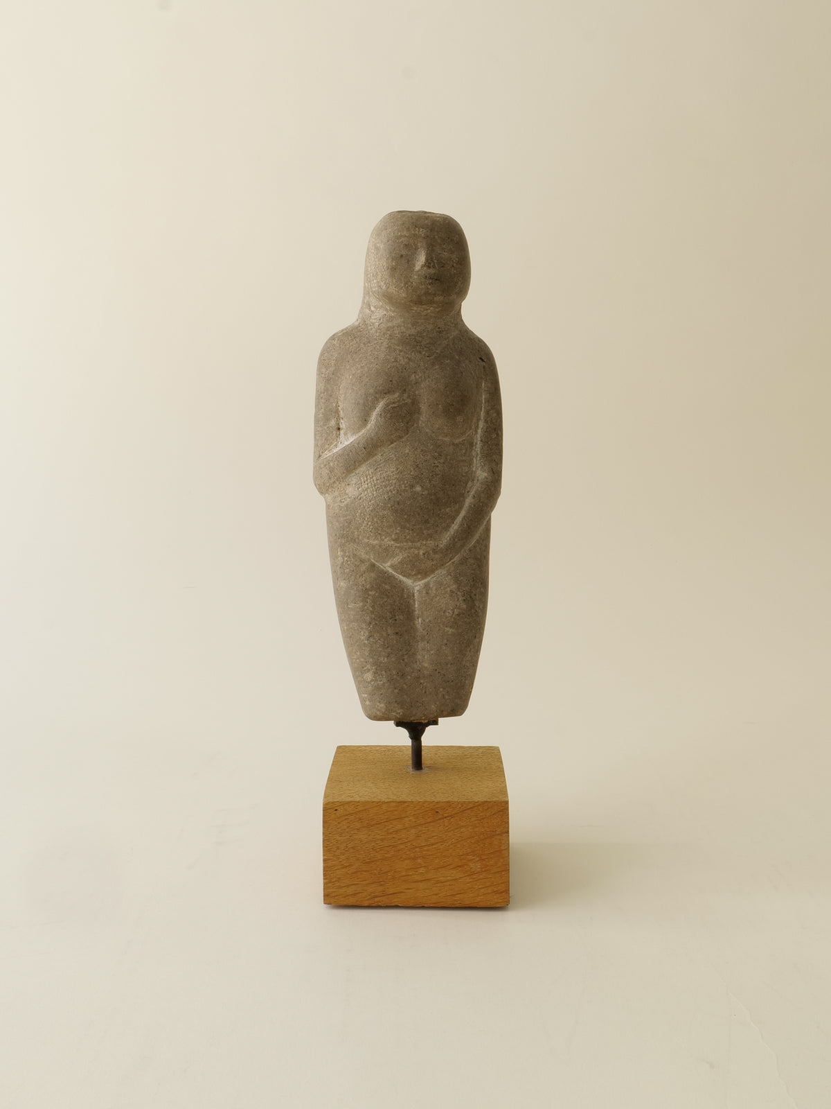 The Marble Figurine Sculpture by Håkan Bonds from Collection apart features a minimalist, rounded form on a wooden base, set against a light background—echoing the evocative style of Swedish midcentury sculpture.
