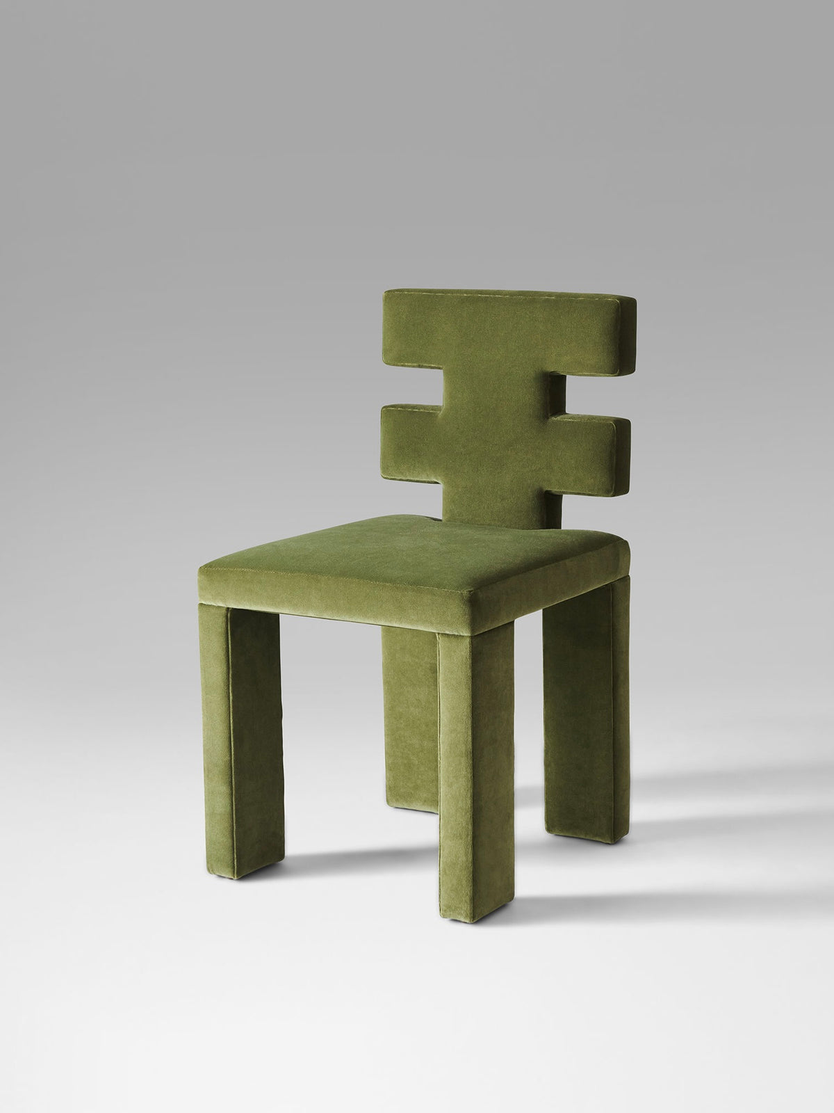 Green velvet H Chair by Estudio Persona side angle view