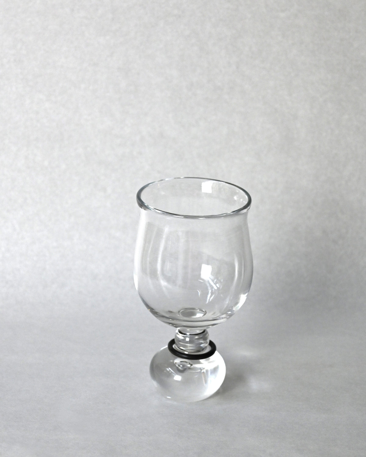 Clear glass goblet with rounded bowl and ball stem from EDEN drinkware set