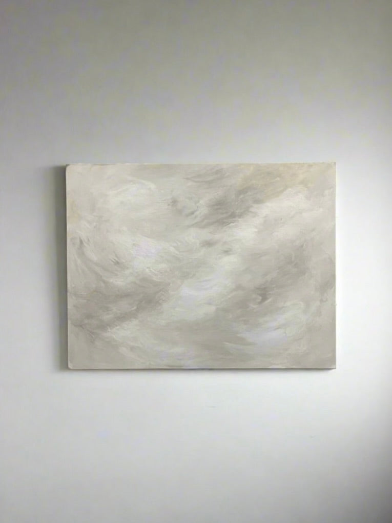 Mattias Storm's "Celestial Drift" Painting showcases abstract swirls in white and light gray, creating a soft, cloudy effect against a plain white wall, embodying mixed media artistry.