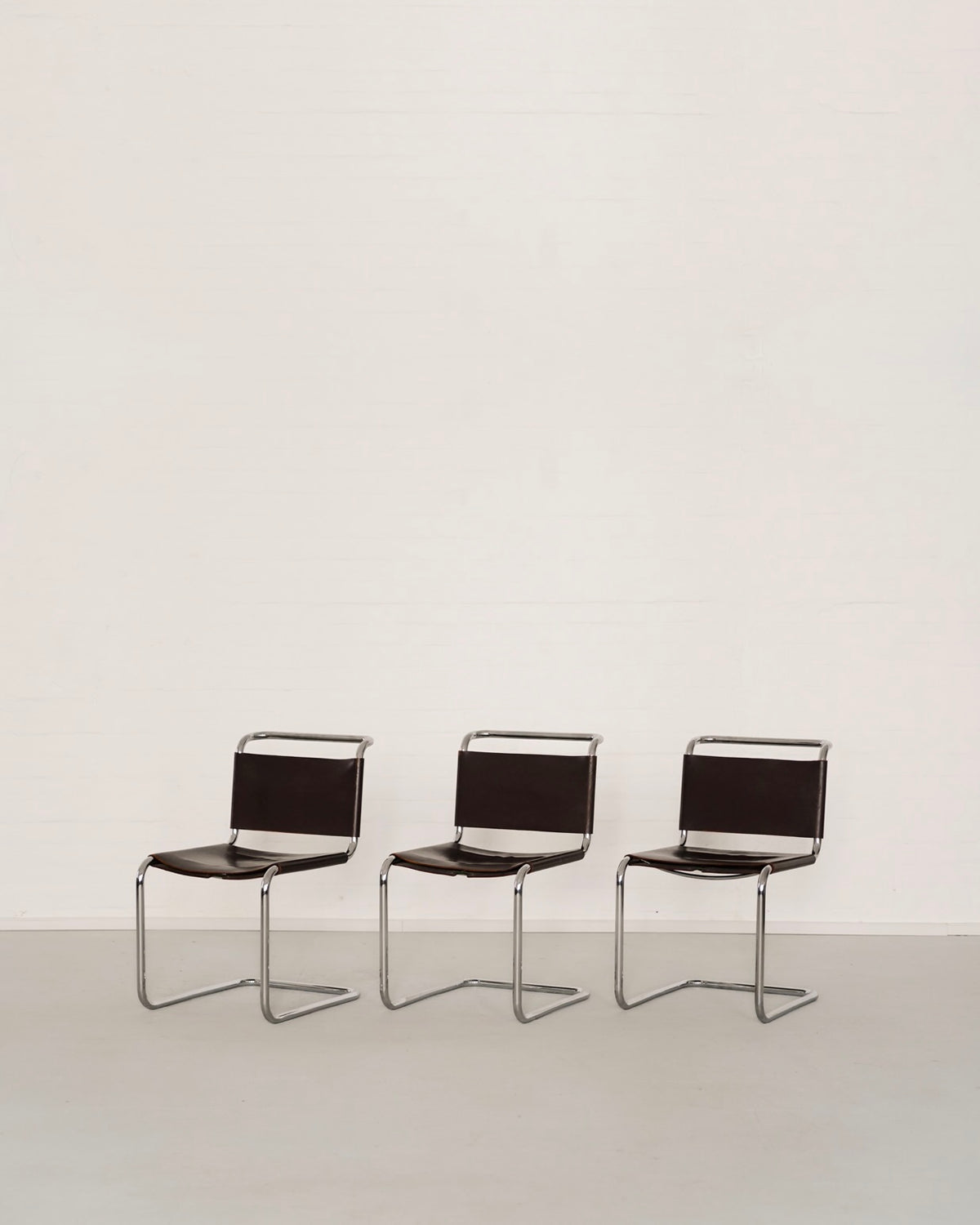 Three black leather B33 cantilever chairs by Marcel Breuer