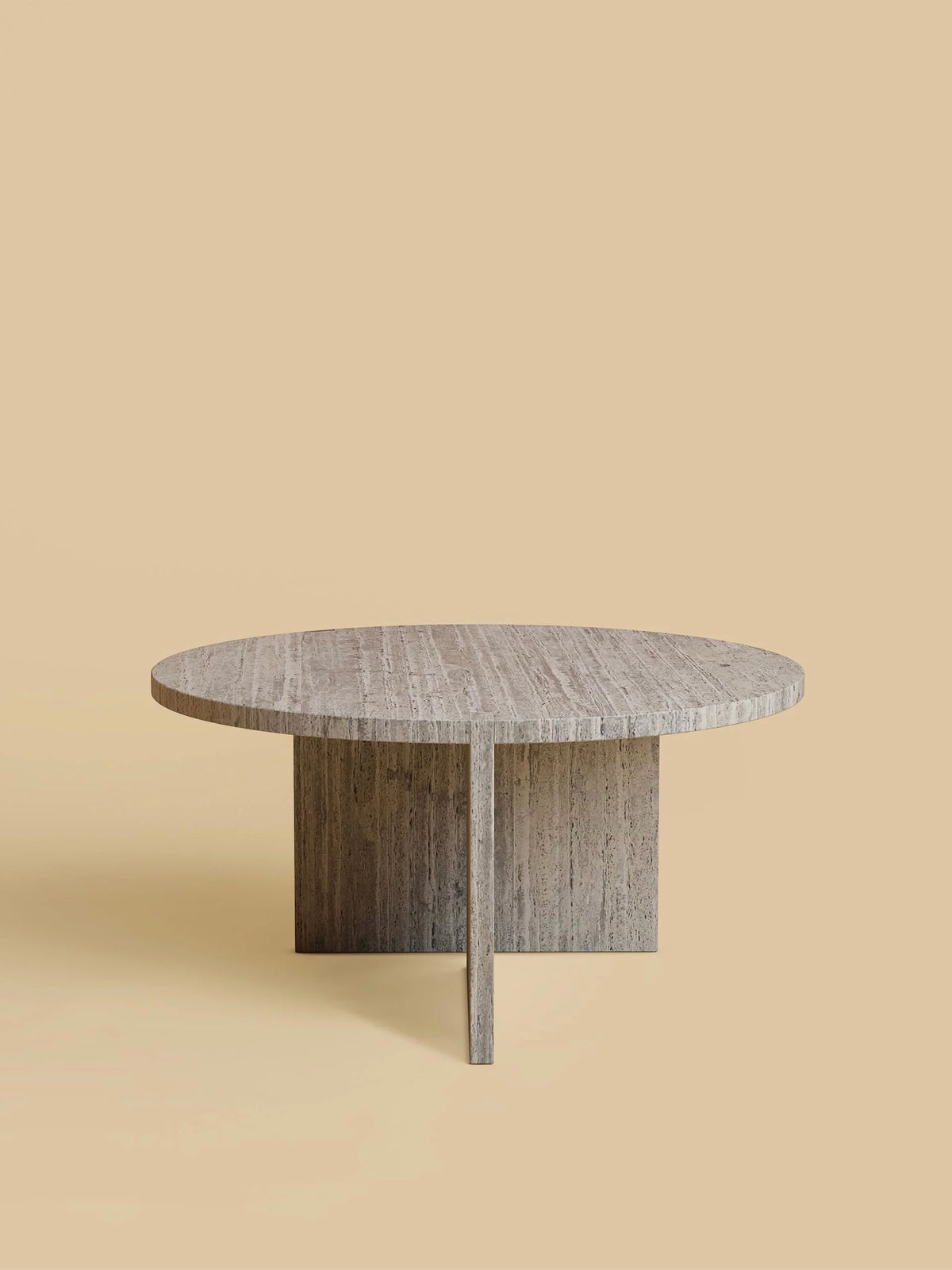 A circular, minimalist wooden table with a natural grain finish sits against a plain beige background, featuring a cross-shaped base. This design by Lebanto gives it modern sturdiness akin to the "Hashi" Coffee Table in Marble.