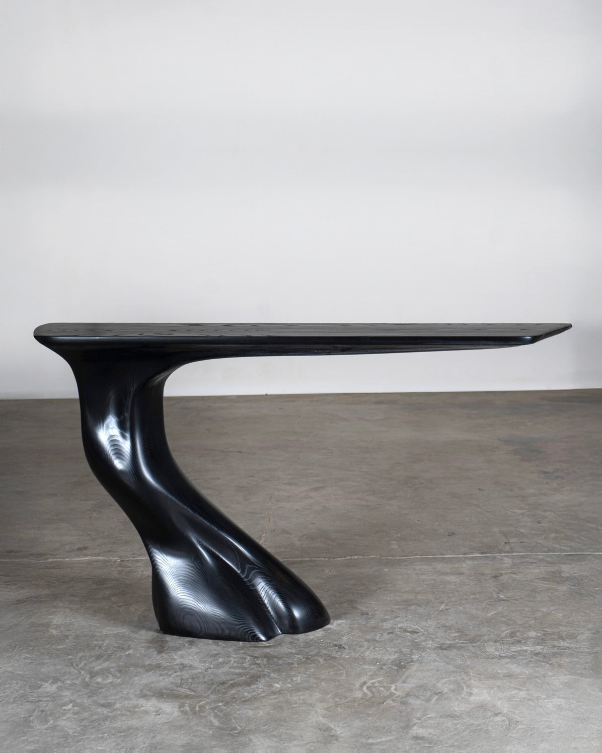 Frolic ash wood console table side profile, ebonized sculptural base by Amorph