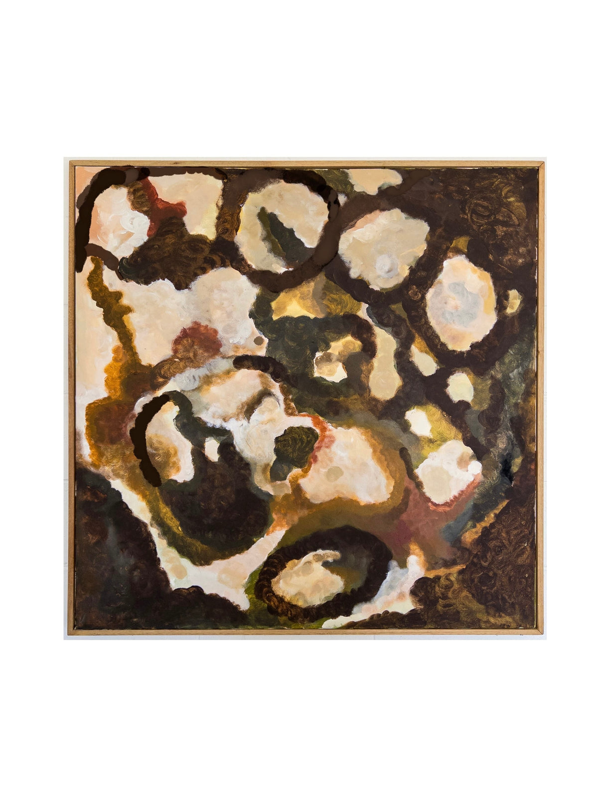 The abstract painting, "That Which Remains" by Natasha France, is presented on a Tasmanian Oak frame and showcases a blend of earthy tones, incorporating shades of brown, beige, and green. The composition features irregular, overlapping shapes and patterns that evoke a sense of depth and organic movement across the canvas through mixed media techniques.