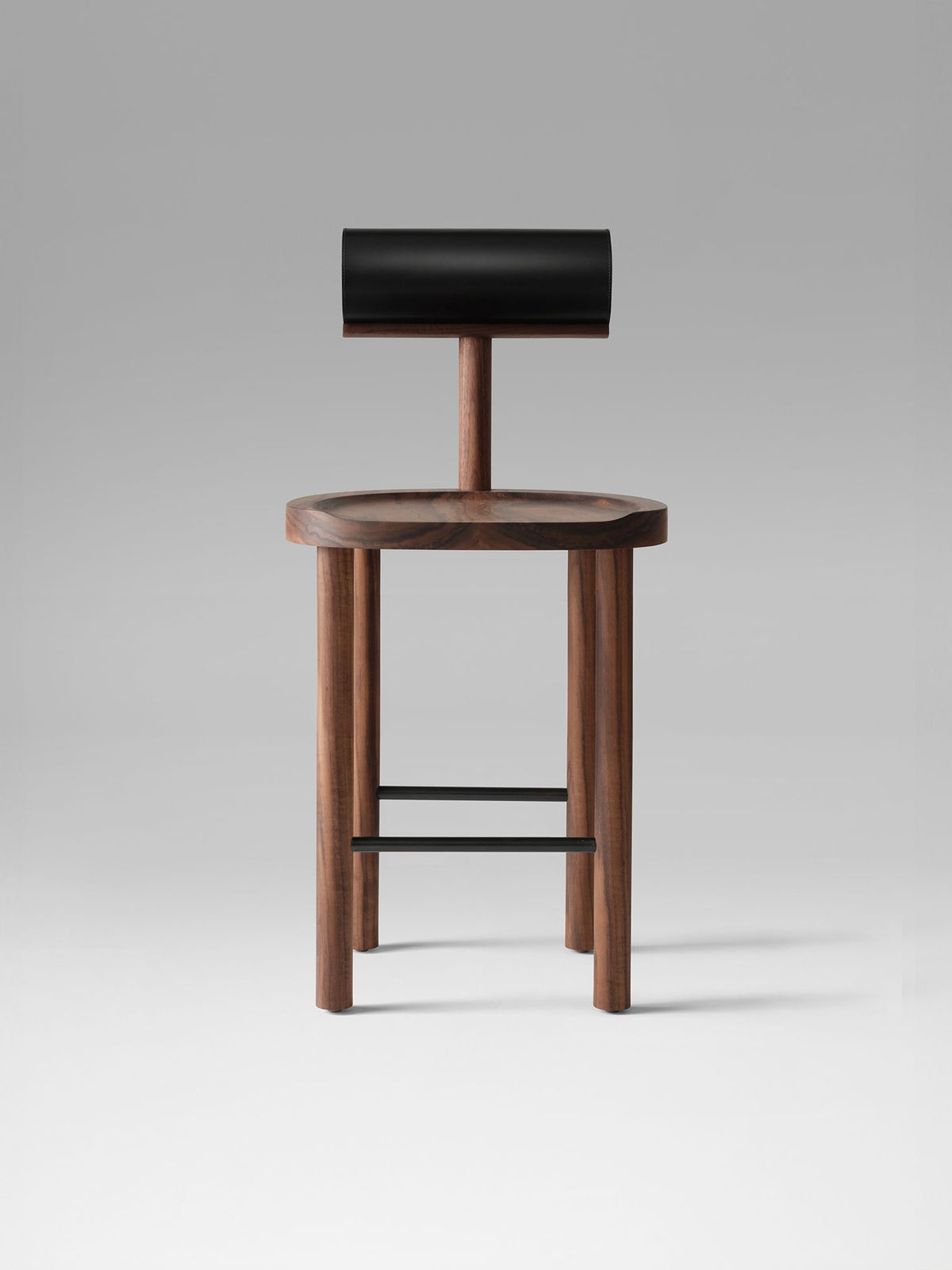 UNA counter stool with walnut frame and black leather backrest