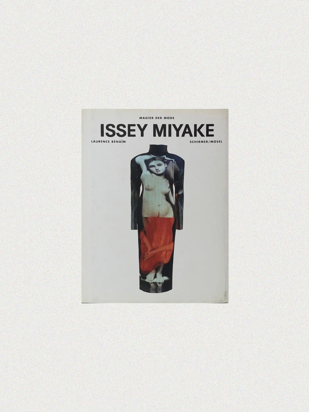 The cover of the "Issey Miyake Book" from Boga Avante Shop, authored by Laurence Benaïm, features a stylized image of a person in layered clothing that highlights contemporary fashion and pleating techniques, with the title and author's name prominently displayed at the top.