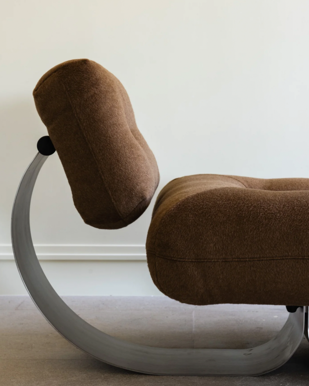 Brown fabric Alta lounge chair by Oscar Niemeyer side profile view