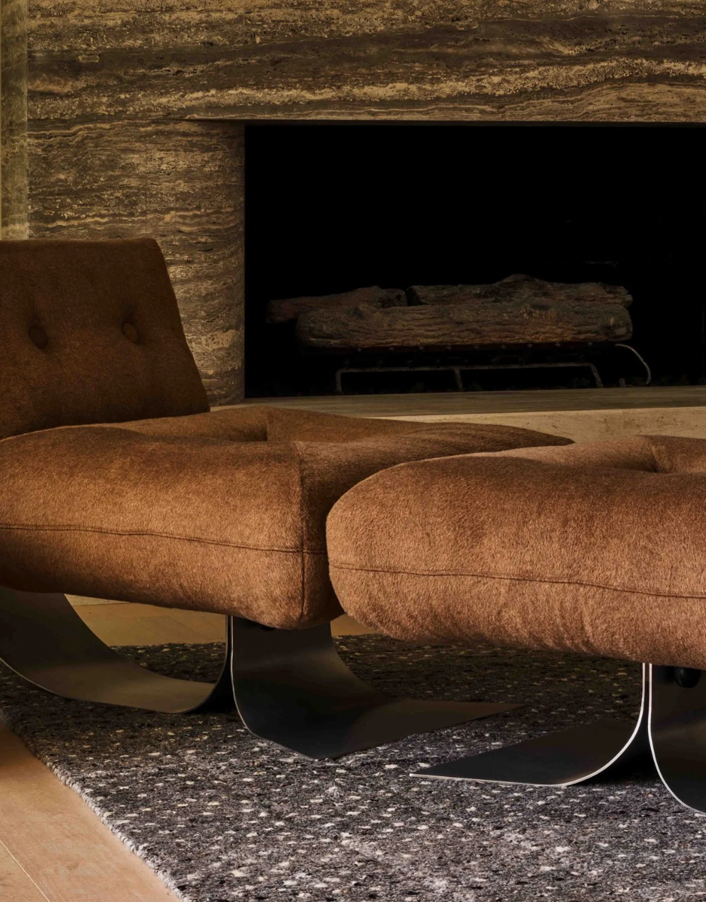 Brown Alta lounge chair and ottoman by Oscar Niemeyer near fireplace