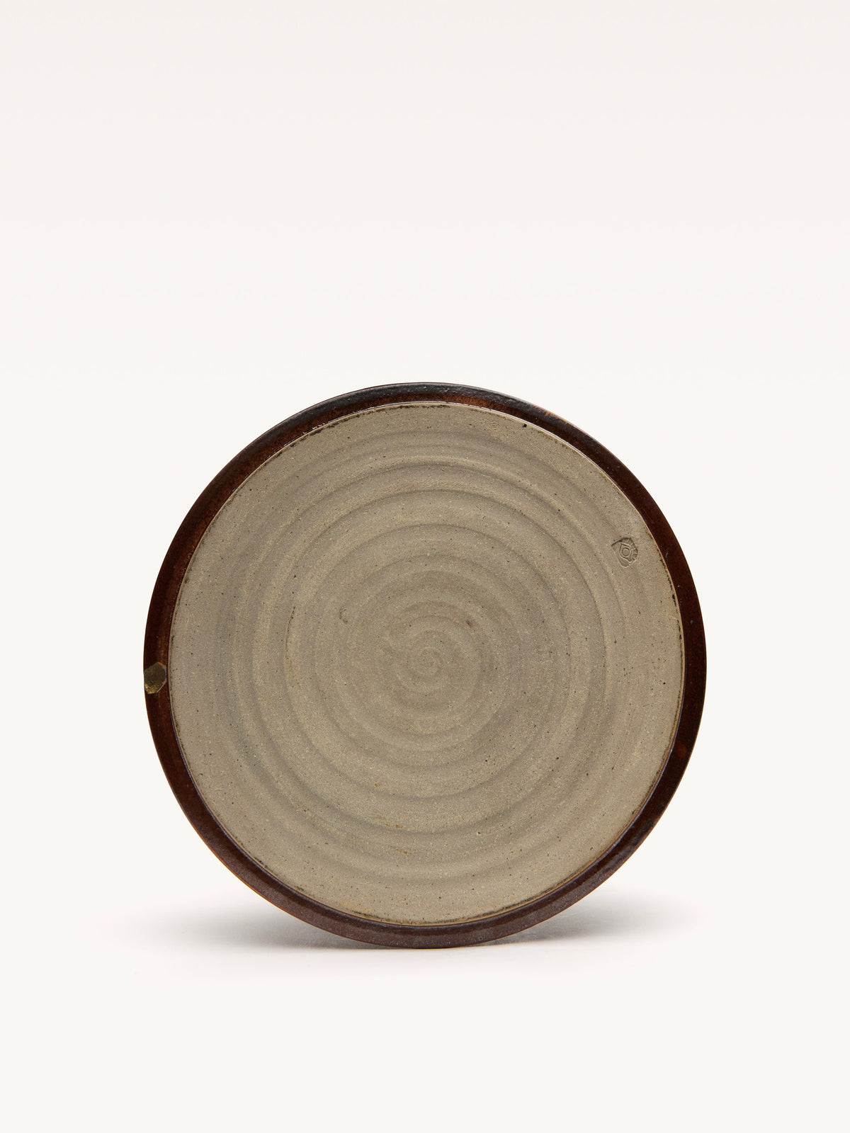 The Galerie MLS Ceramic Bowl has a concentric pattern in an art deco style with a dark brown rim, a lighter spiral design at the center, and a plain white background.