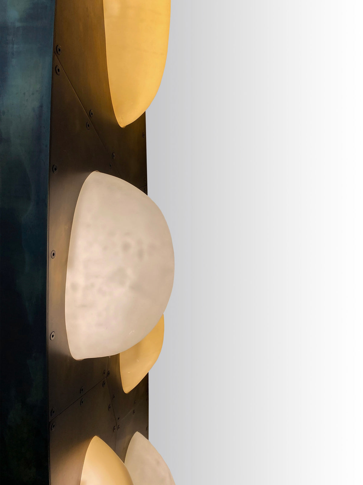 Close-up detail of curved glass bubble elements on Bubbles chandelier