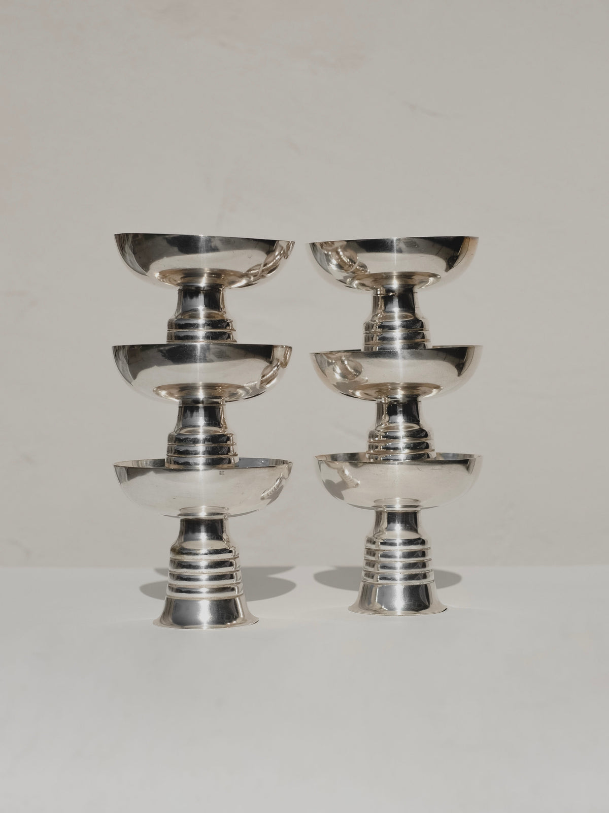 Set of 6 polished silver ice coupes stacked in two columns