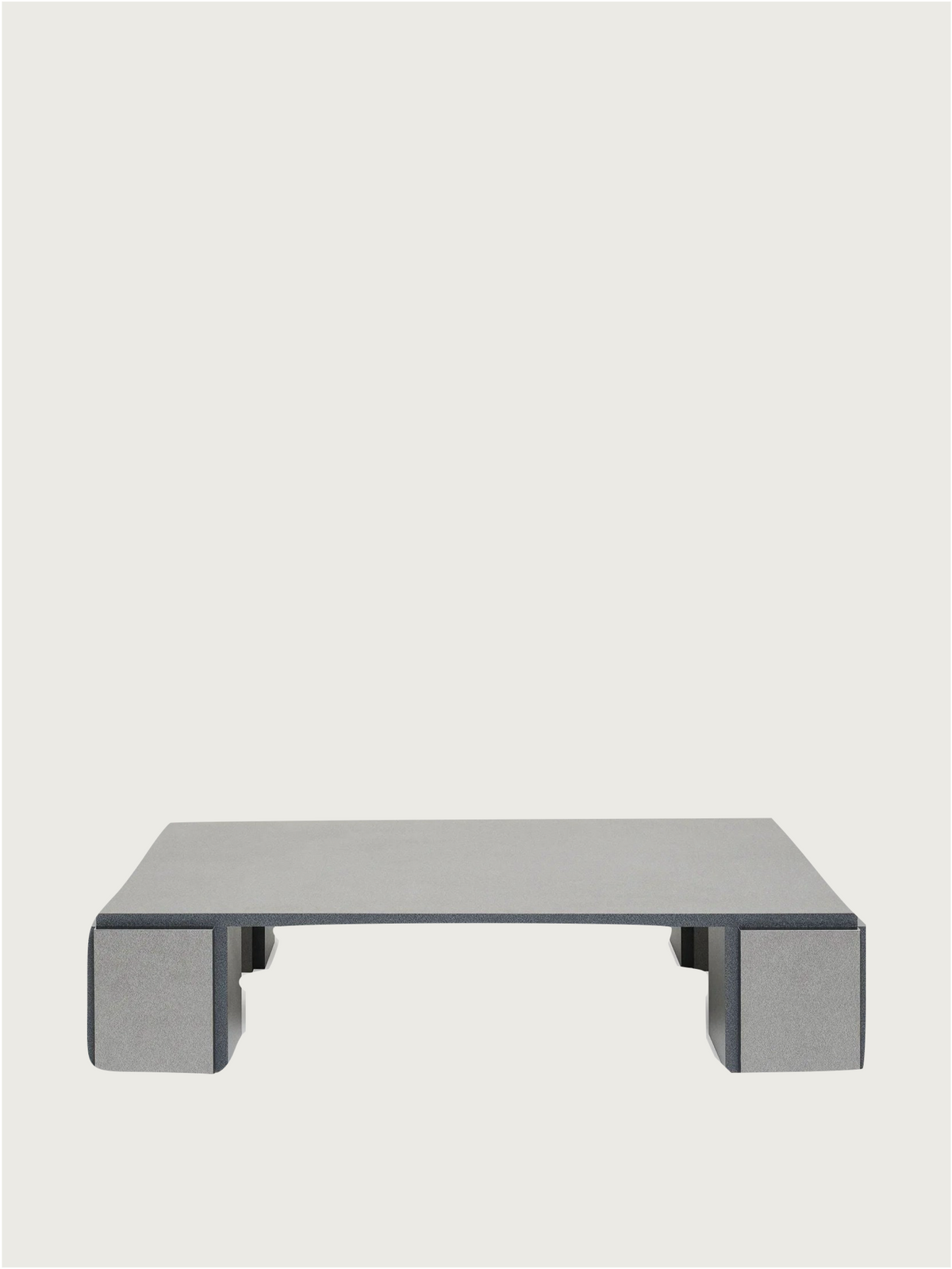 The "Mara" Coffee Table – Night Noise by TEGET features a modern, minimalist gray design with clean lines and open space, inspired by laminated furniture, perfect for elevating your decor.