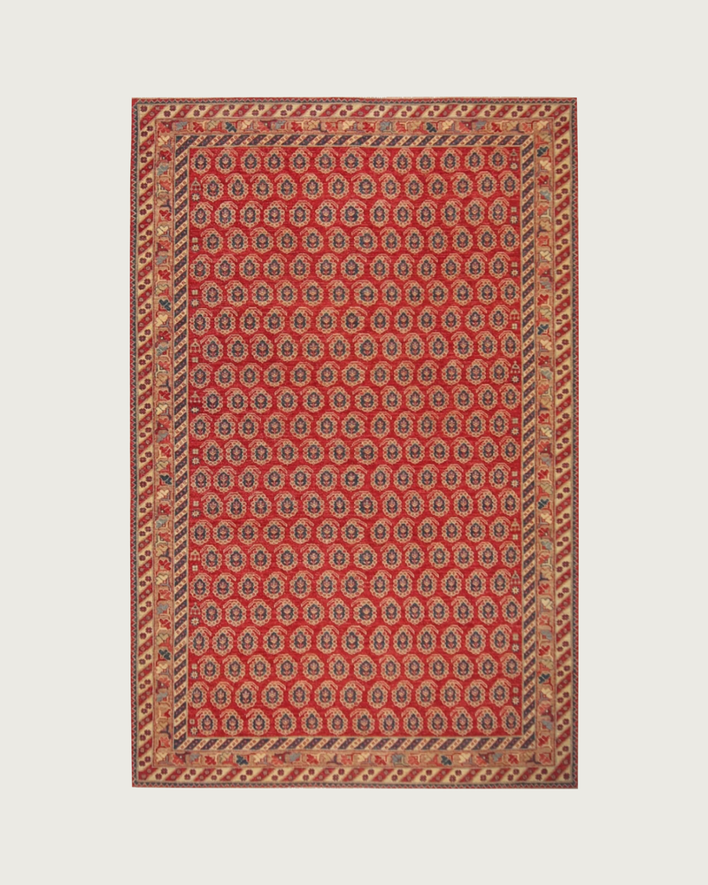Red boteh hand-knotted wool rug with allover paisley pattern