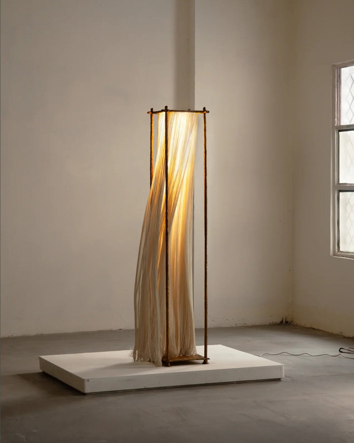 Ito floor lamp by Stem with illuminated draped textile frame