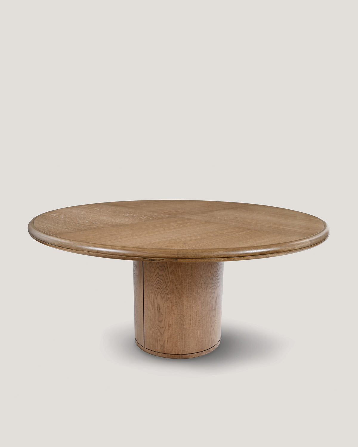Moon round dining table in natural oak with cylindrical pedestal base