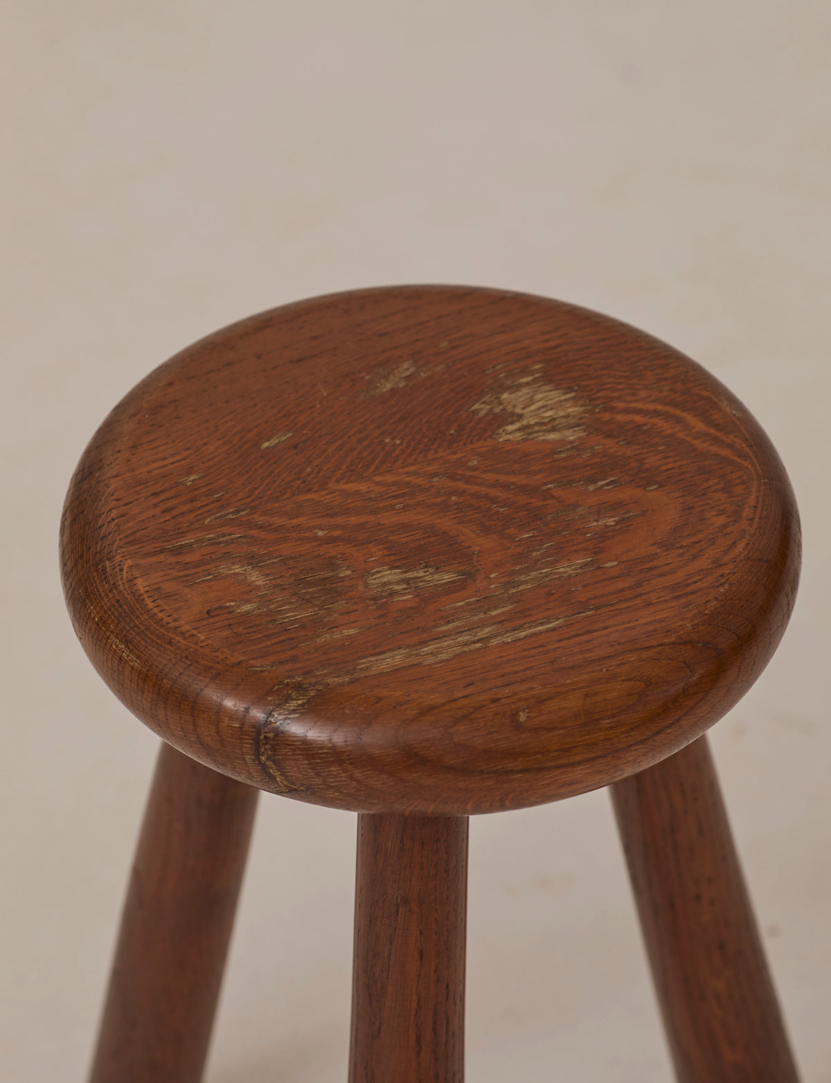 Brutalist Tripod Stool Handcrafted in Solid Oak Wood C. 1960 — close-up of worn oak seat texture
