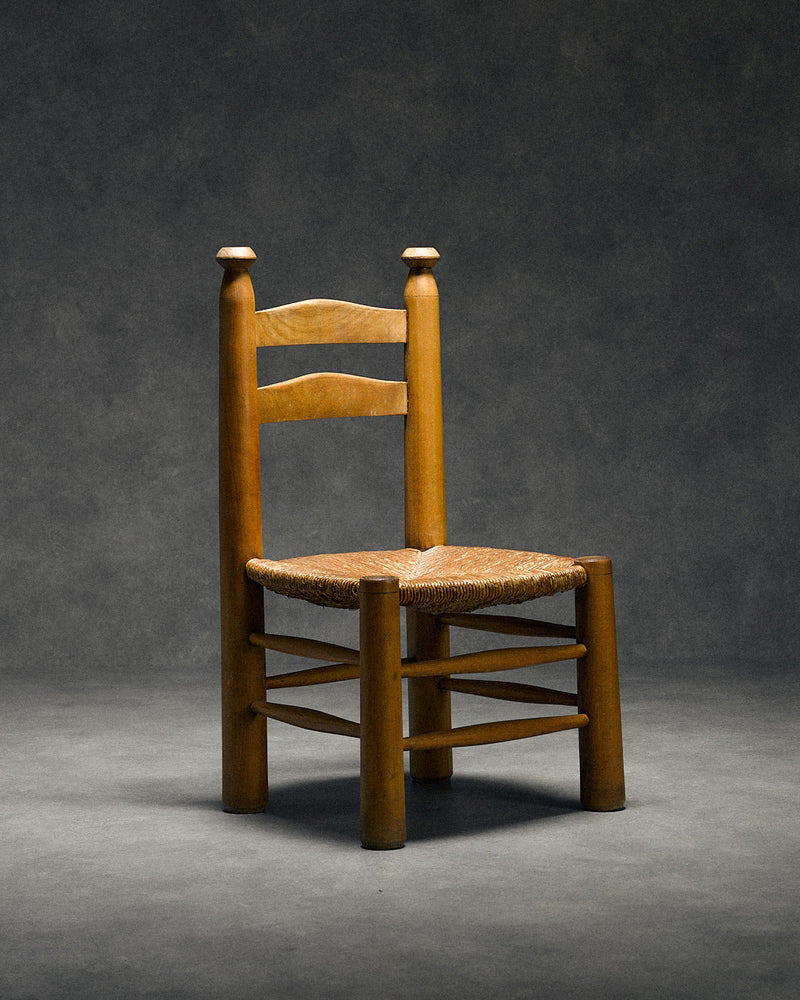 low chair with rush seat, attributed to Charles Dudouyt — close-up