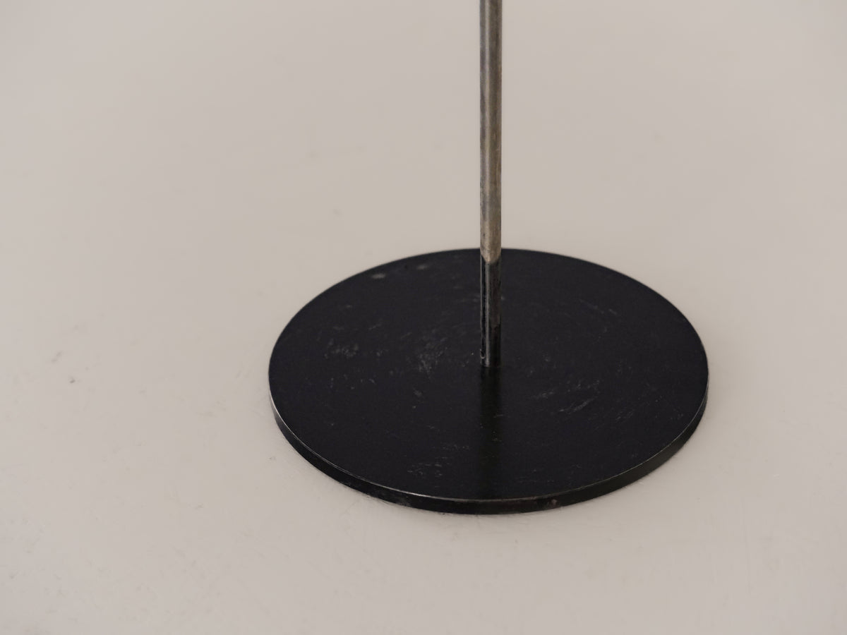 Close-up of M60 floor lamp black circular base with steel pole