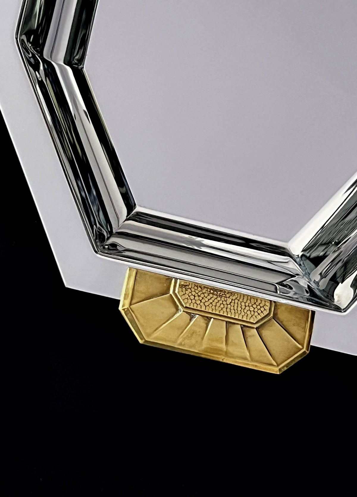 Stainless steel and brass corner detail of vintage serving dish