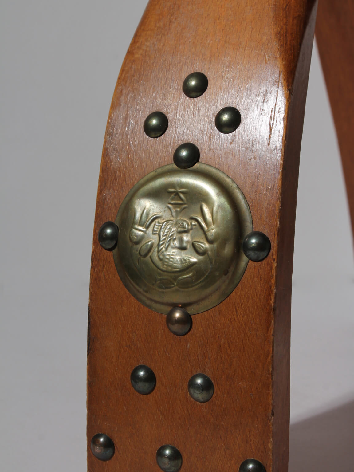 Egyptian Ottoman Camel Saddle Stool — close-up of brass detail on wooden leg