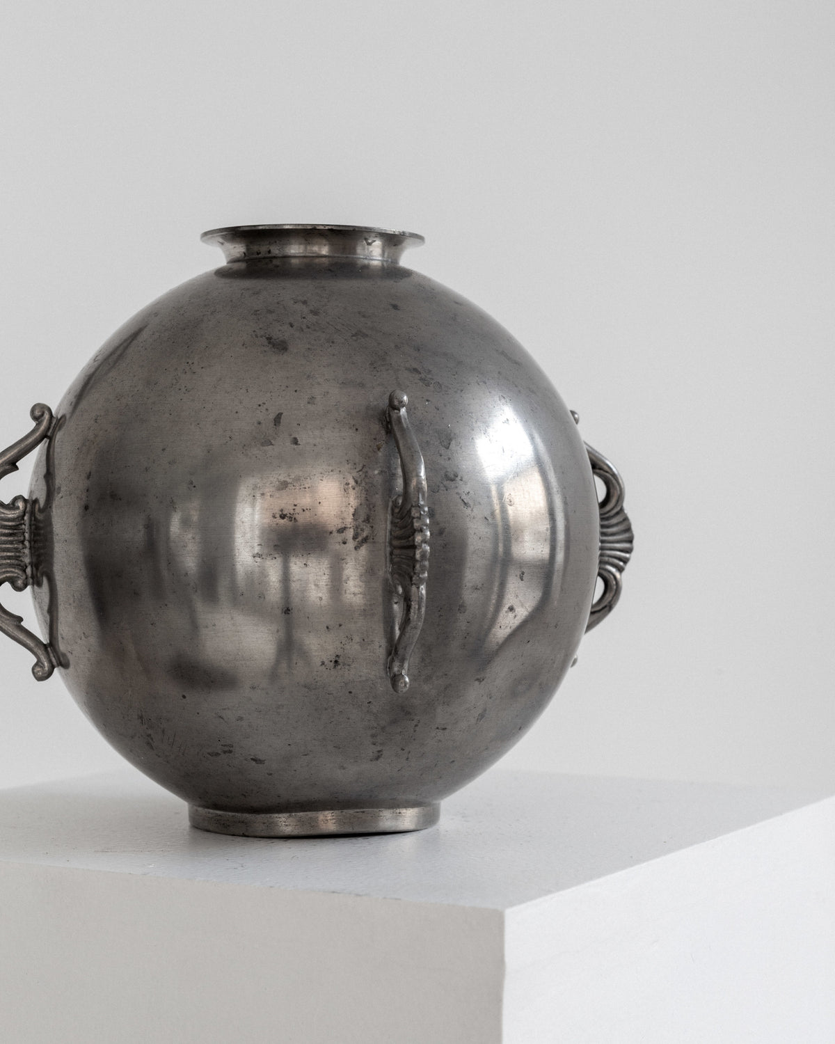 Spherical Art Deco Pewter Vase by C.G. Hallberg, 1934 — back view on white pedestal