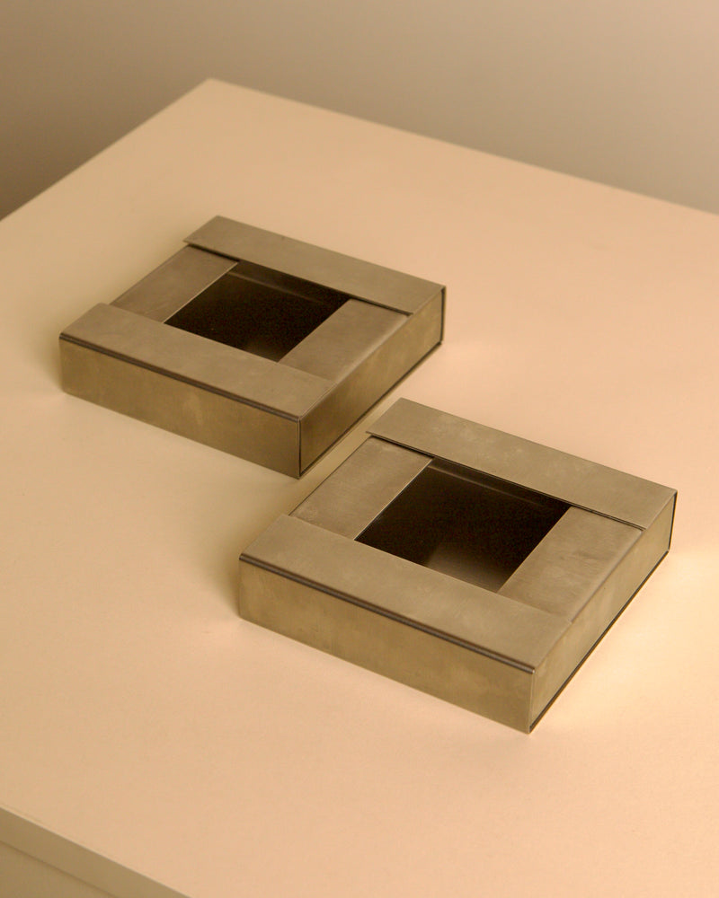 Pair of Italian brushed metal ashtrays by Fontana Arte, 1960s — detail view