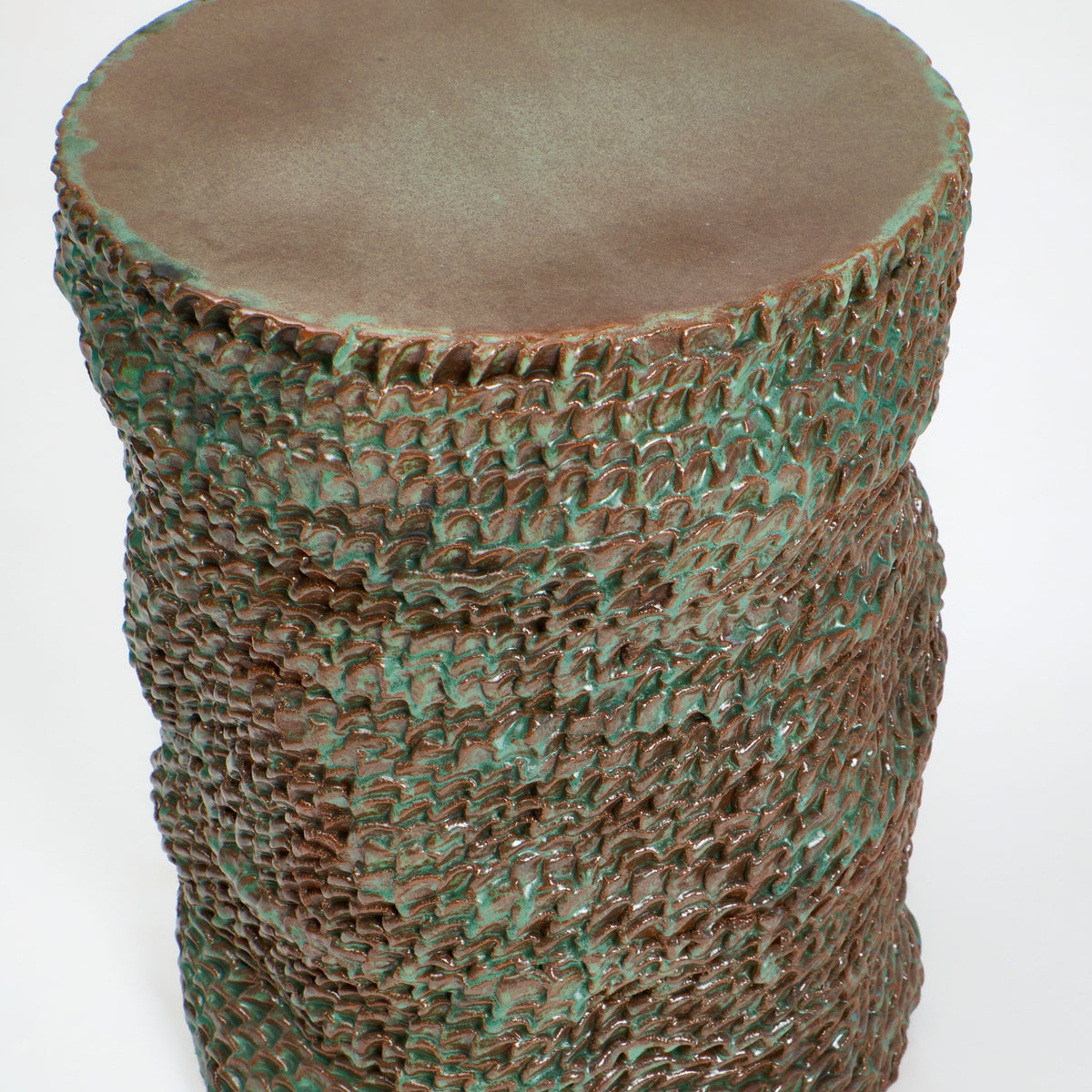 Casa Ceramic Side Table — top view of textured green ceramic surface