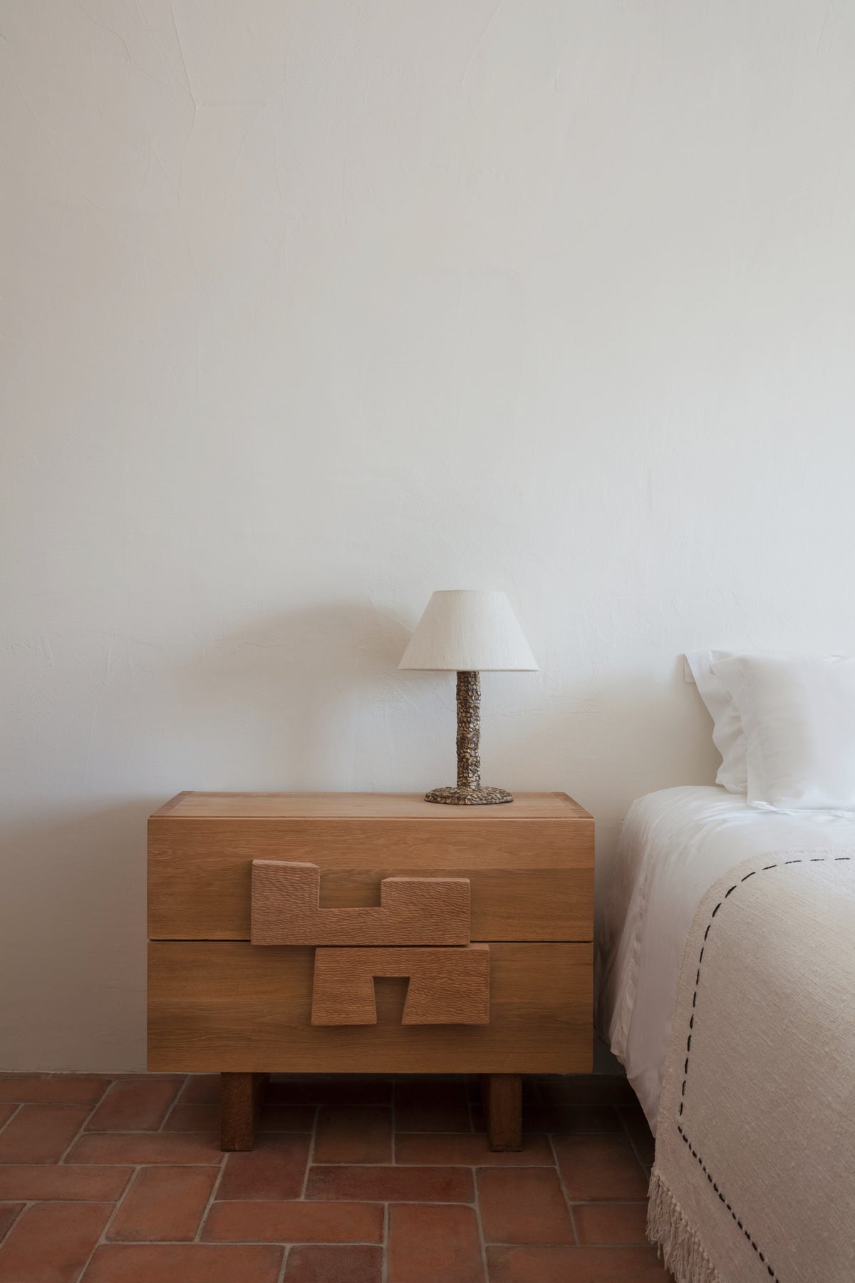 Casa Bedside Light — top view on wooden nightstand with beige lampshade