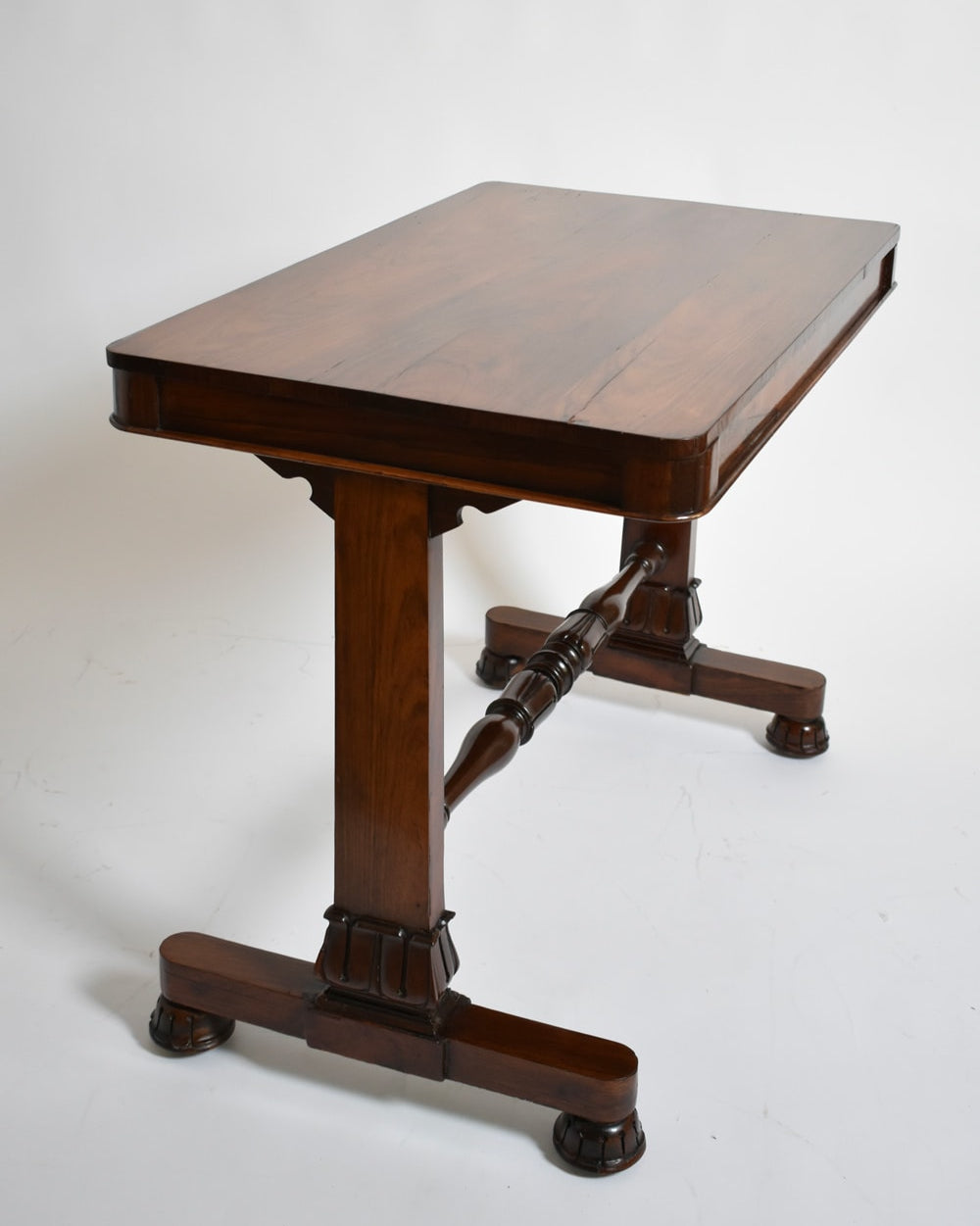 Victorian mahogany console table, 1910s — angled view highlighting sturdy wooden legs