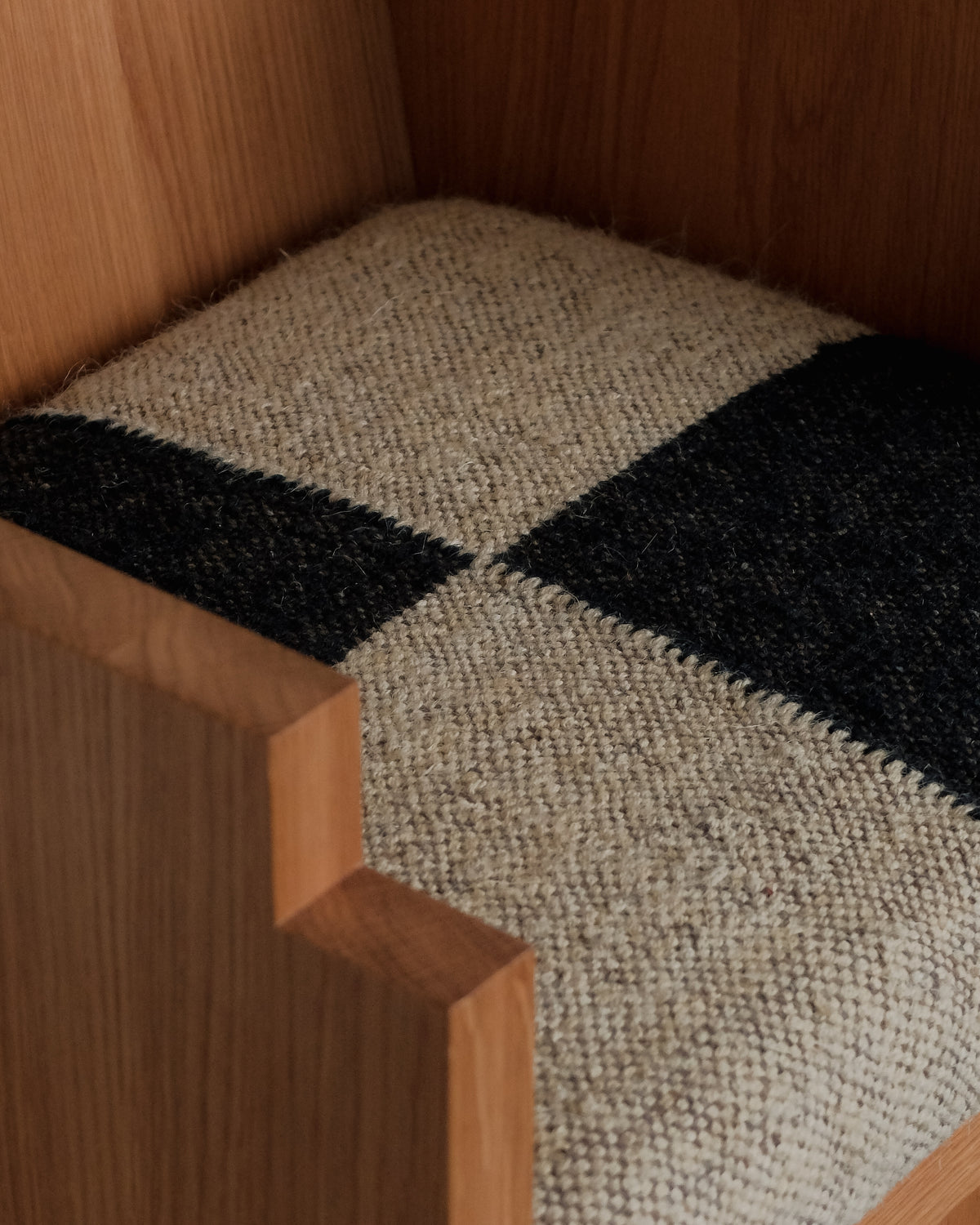 Frankie Chair — close-up of woven textile seat in wooden frame