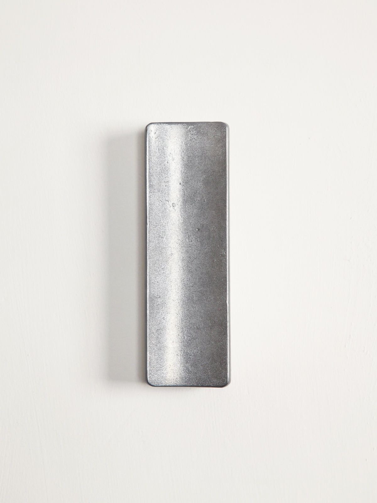 Arc Pen Tray — top view of brushed metal surface
