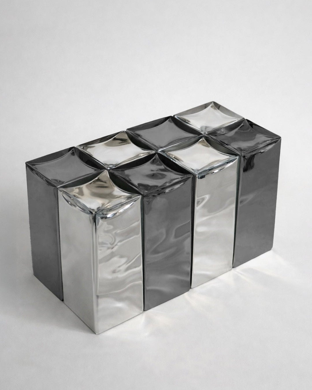 MONOLIT' Bench — angled view of reflective metal surface