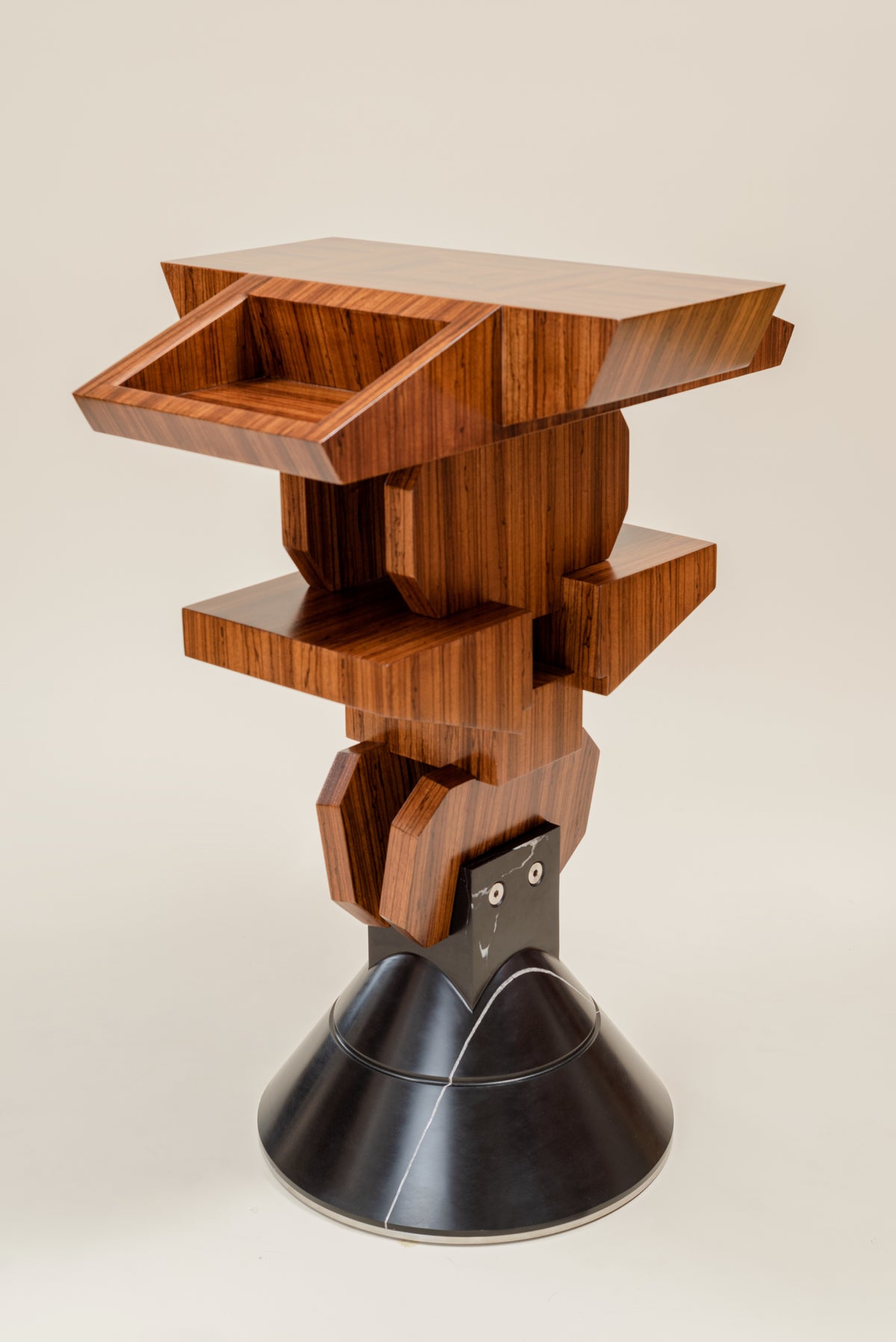Pyramiss Pedestal Table — top view of layered wooden design