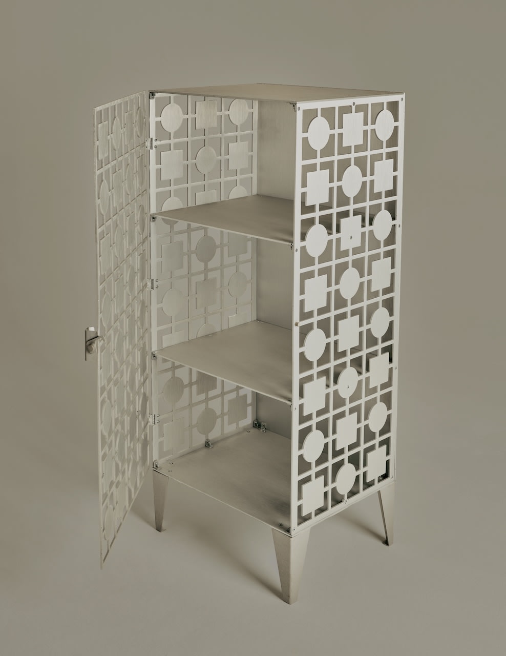 White geometric lattice cabinet with doors open showing interior shelves