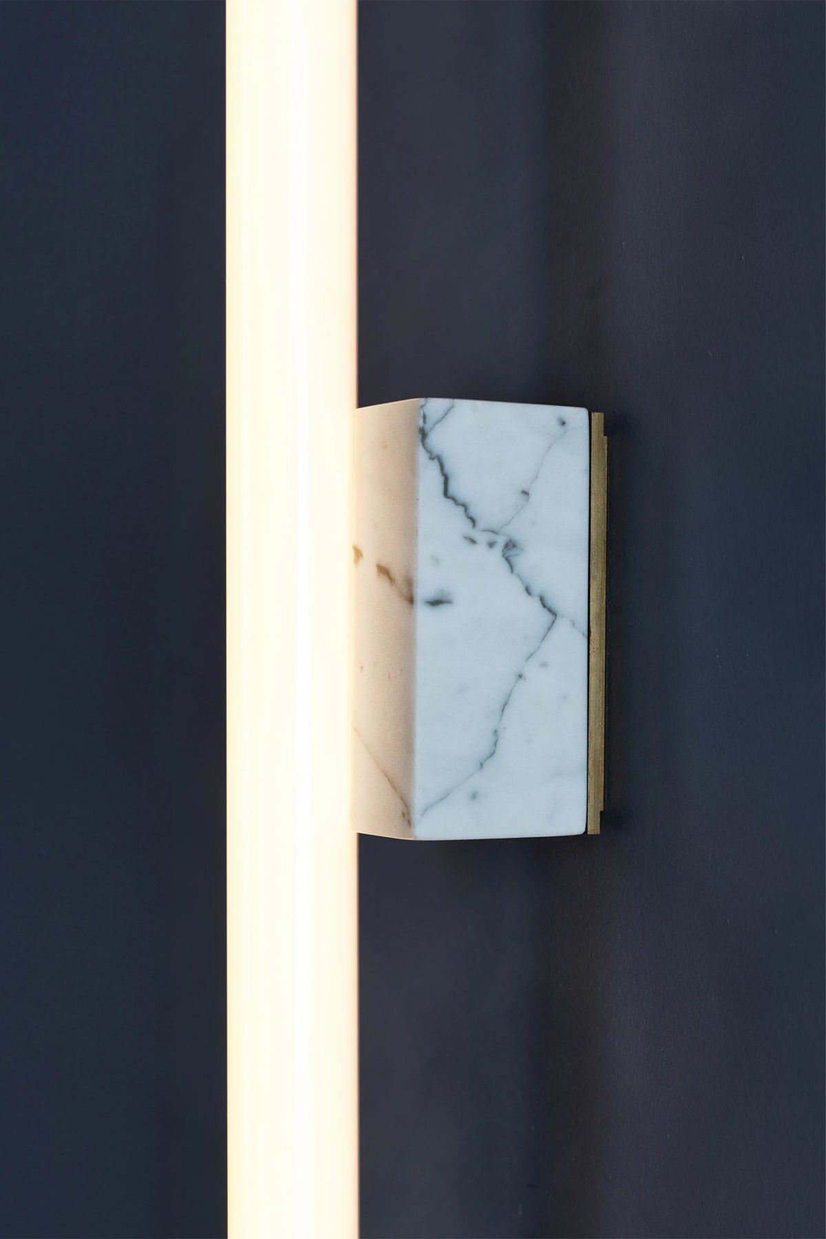 NEA MARBLE 50 — side angle showing marble base with brass detail