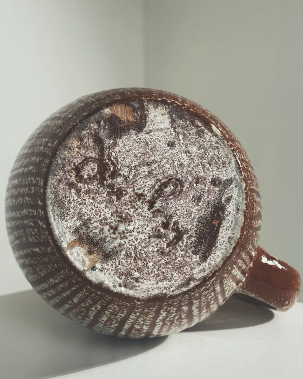 Zoomorphic Pitcher by the Accolay potters — bottom view showing textured ceramic surface
