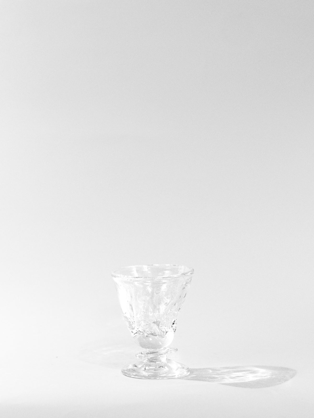 Blown Free-shaped Glass — back view on white background